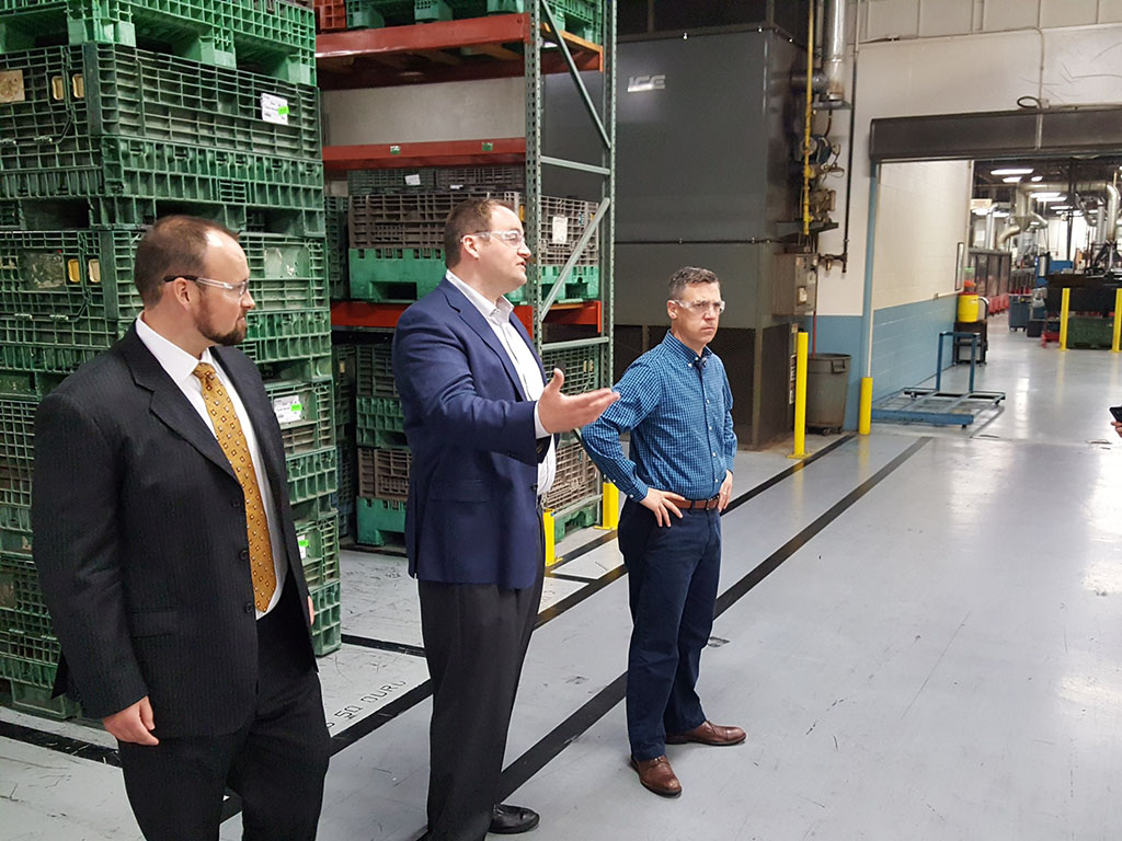 Congressman Jim Banks and Gary Jones discuss rail product inserts at Press-Seal