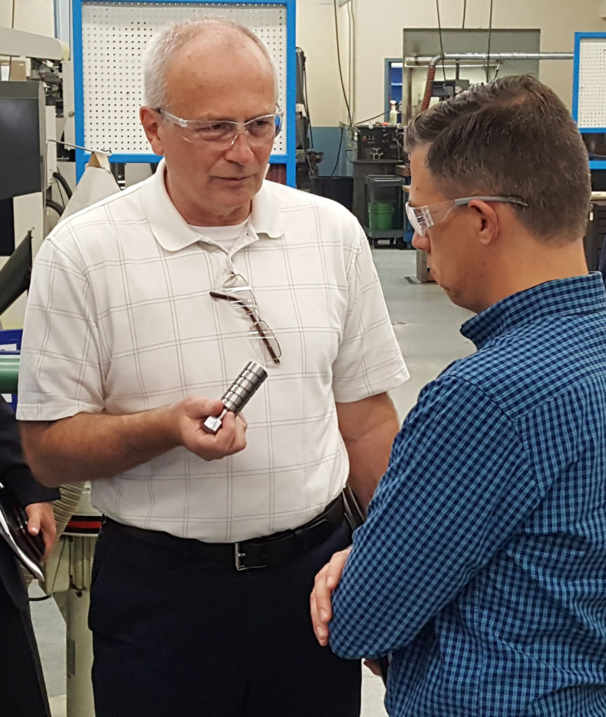 Congressman Jim Banks and Gary Jones discuss rail product inserts at Press-Seal