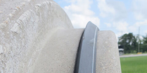 Closeup of a rubber gasket sitting on concrete pipe joint