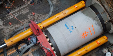 Looking down hole at large concrete pipe